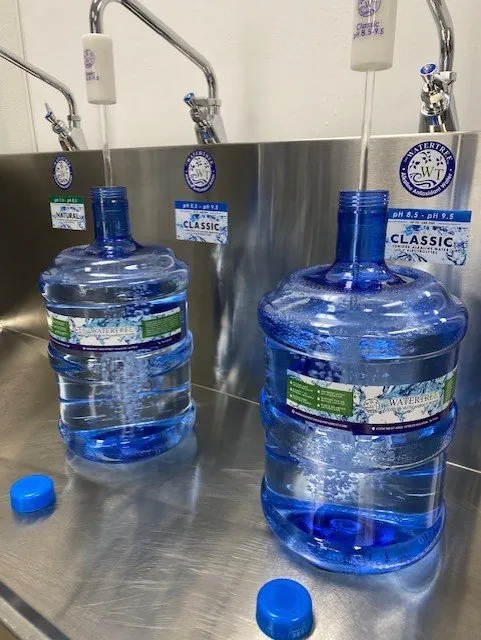 Five-gallon bottles being filled at the Water Tree Oak Forest refill station